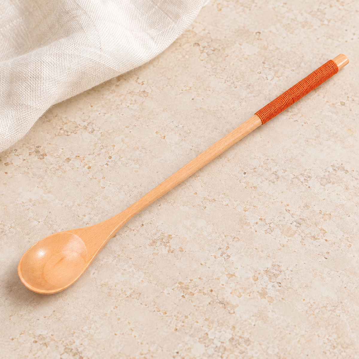 LöffelKlar – einzelner heller Löffel mit orangefarbenem Griffband